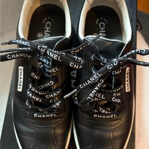 CHANEL Black and White Logo Lace-Up Sneakers